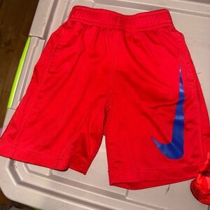 Nike Red Kids Athletic Shorts with Blue Swoosh
